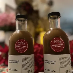 two bottles of coffee on a table