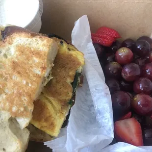 The Breakfast Sandwich comes with fruit and whipped cream