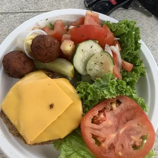 Delicious turkey burger with salad.