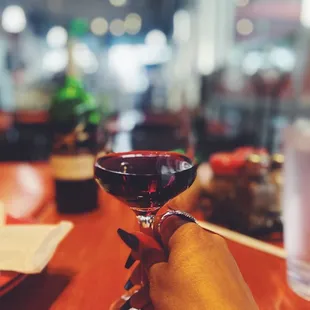 a person holding a wine glass