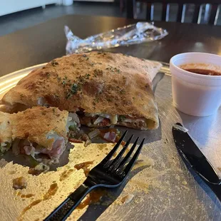 Meat Calzone with onions and Bell peppers added. Pretty tasty. Big portion.