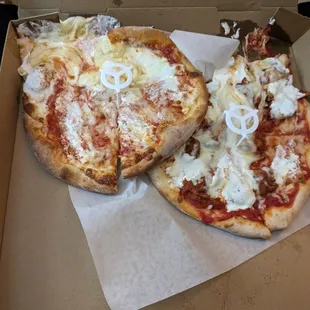two slices of pizza in a box