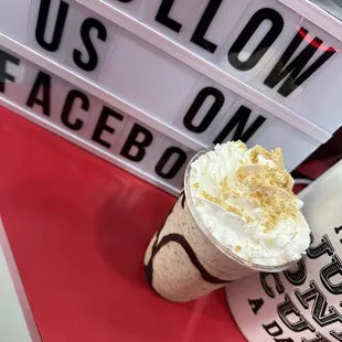 a cup of coffee with whipped cream