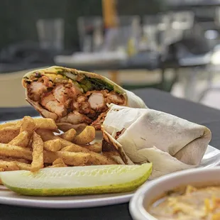 Buffalo Chicken wrap   Crispy Chicken Tenders Tossed in a Buffalo Sauce, Swiss Cheese, Mixed Greens, Pickles, Wrapped in a Flour Tortilla