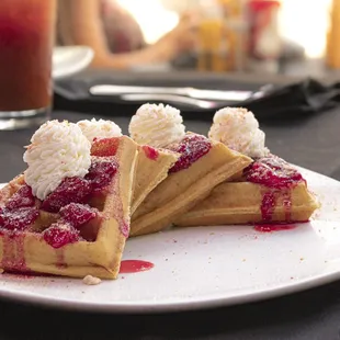 Strawberry Short-Waffle Golden Brown Malted Waffle Topped with a Strawberry Glaze, Whipped Cream and Strawberry Crumble