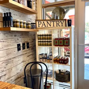 a pantry with jars of food