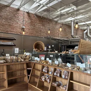 a display of bread and pastries in a bakery