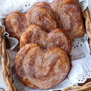 a basket of pastries and a glass of milk