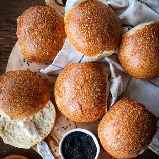 a bunch of buns on a cutting board