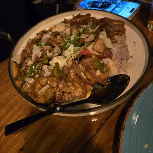 Shrimp and grits.  My wife loved it, but said she would order it next time.With the grits, separate from everything else.