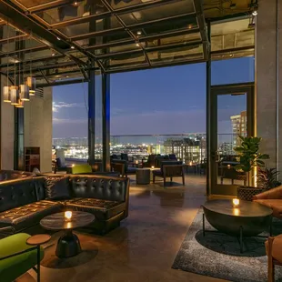 a living room with a view of the city