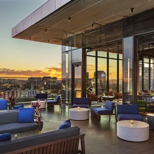 a view of the city from a rooftop bar