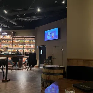 the inside of a restaurant with tables and chairs