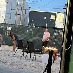 people playing in the sand