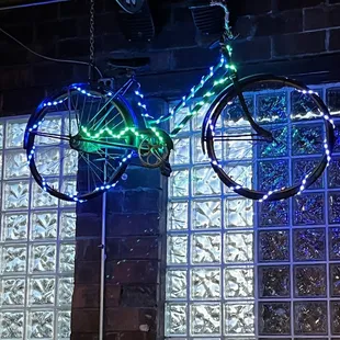 a bicycle hanging from the ceiling