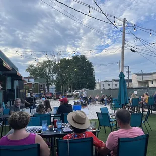 people sitting at tables outside