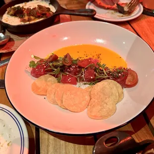 Nico&apos;s Tuna Tostada (mango leche de tigre, tuna, sesame togarashi vinaigrette, quinoa pop, fresno peppers, baby tomato)