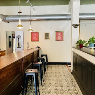 a row of stools in a coffee shop