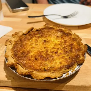 a pie on a wooden table