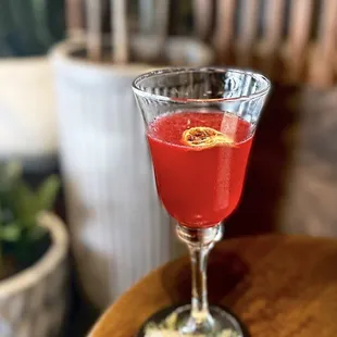 The Gardener's Daughter: Roku Japanese gin, raw organic beets, cold pressed lemon, chili, topped w/ sparkling