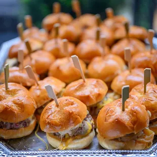 a tray of mini sandwiches