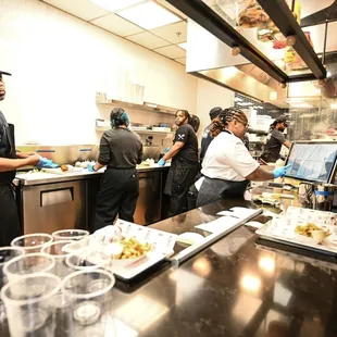 a group of people preparing food