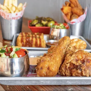 a tray of fried chicken and french fries