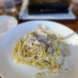 Parmesan Cheese Fettuccine With Black Truffle served from Parmesan Wheel