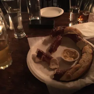 a plate of food and a glass of beer