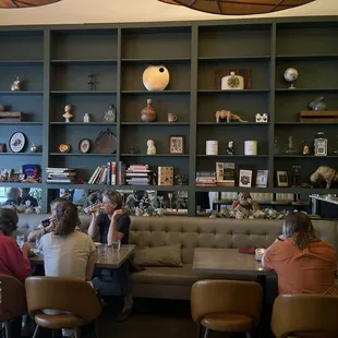 Eclectic bookshelves in the dining room