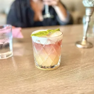 Can't remember the name of this delicious cocktail. Espresso martini being enjoyed in the back!