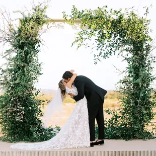 First kiss as newlyweds on the ceremony lawn!