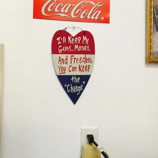 a coca cola sign on a wall
