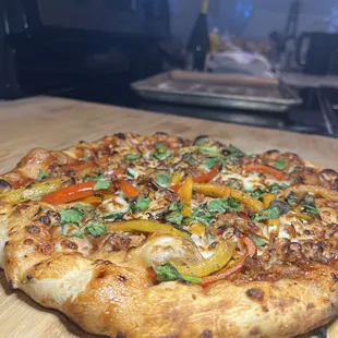 a pizza on a cutting board