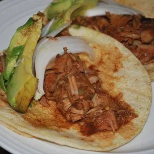 two tacos on a plate