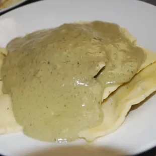 a plate of pasta and sauce