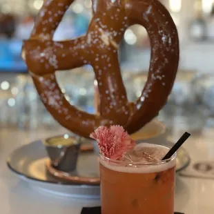 a pretzel and a drink