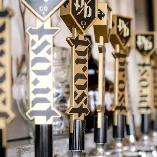 a row of beer taps