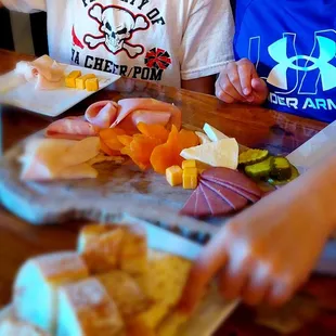 Kid6 charcuterie board was a hit! We loved our cocktails and wraps too! Gem of a place for the whole family of foodies!