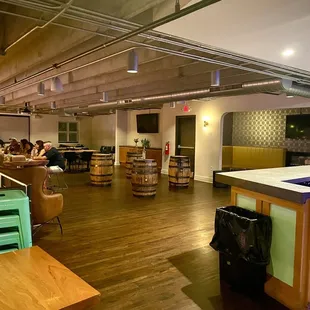 people sitting at tables in a bar