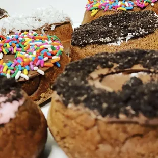 a variety of donuts with sprinkles