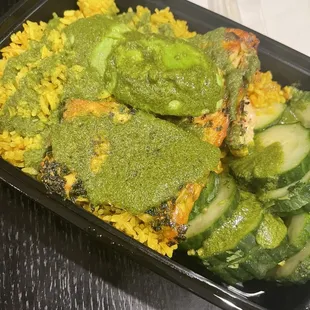 Omega 3 - salmon, tumeric rice, cucumbers, avocado, topped with chimichurri