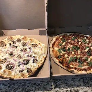 Told you I'd be back soon!  Lol. White pie added extras (left) Low rider (right). Both amazing. So glad I found this place.