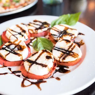 a plate of grilled tomatoes