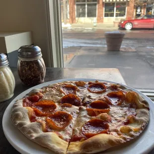 a pizza with pepperoni on it