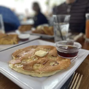 Side of banana pancake- raw in the middle.