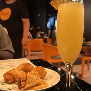 Mimosa and salmon egg rolls