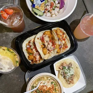 a variety of tacos and drinks