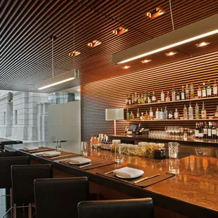 a bar with a long wooden counter