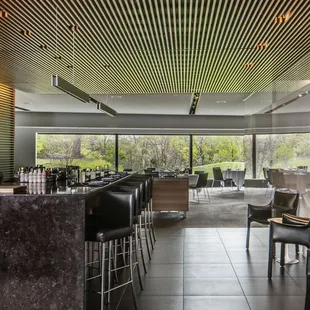 a bar with a view of a golf course